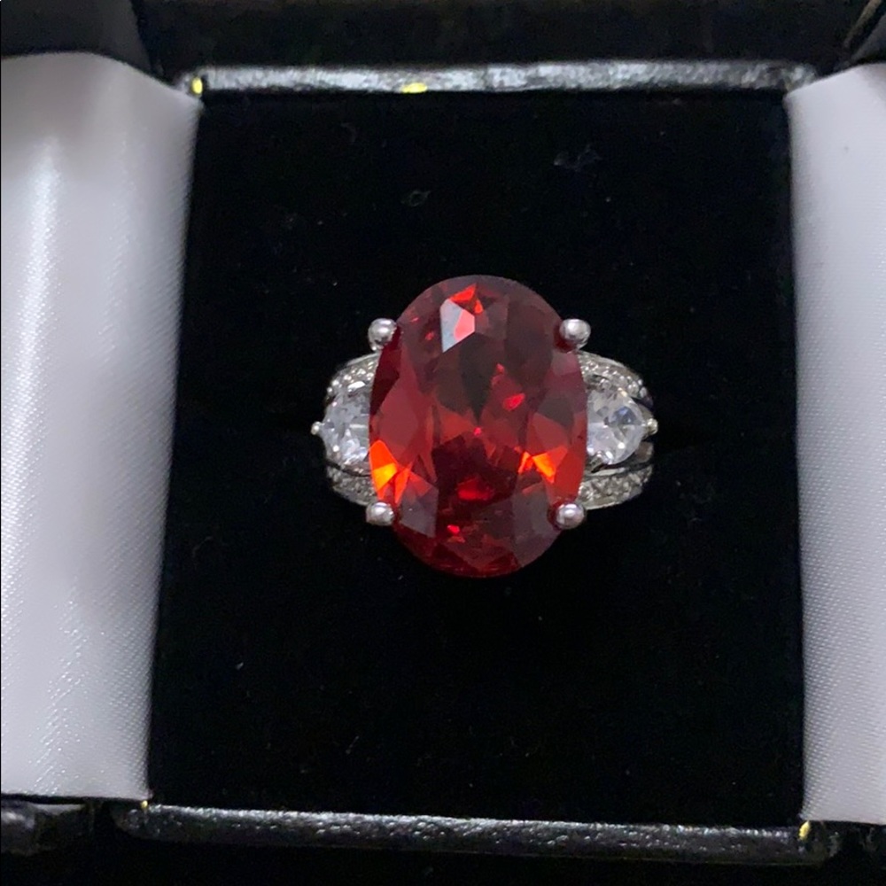 Size 8 silver ring, massive blood red gemstone.